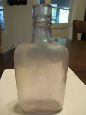 T-8974 Chrysler Outboard Corp Amethyst Number 5 Half Pint Glass Flask Applied Crooked Top 1900s